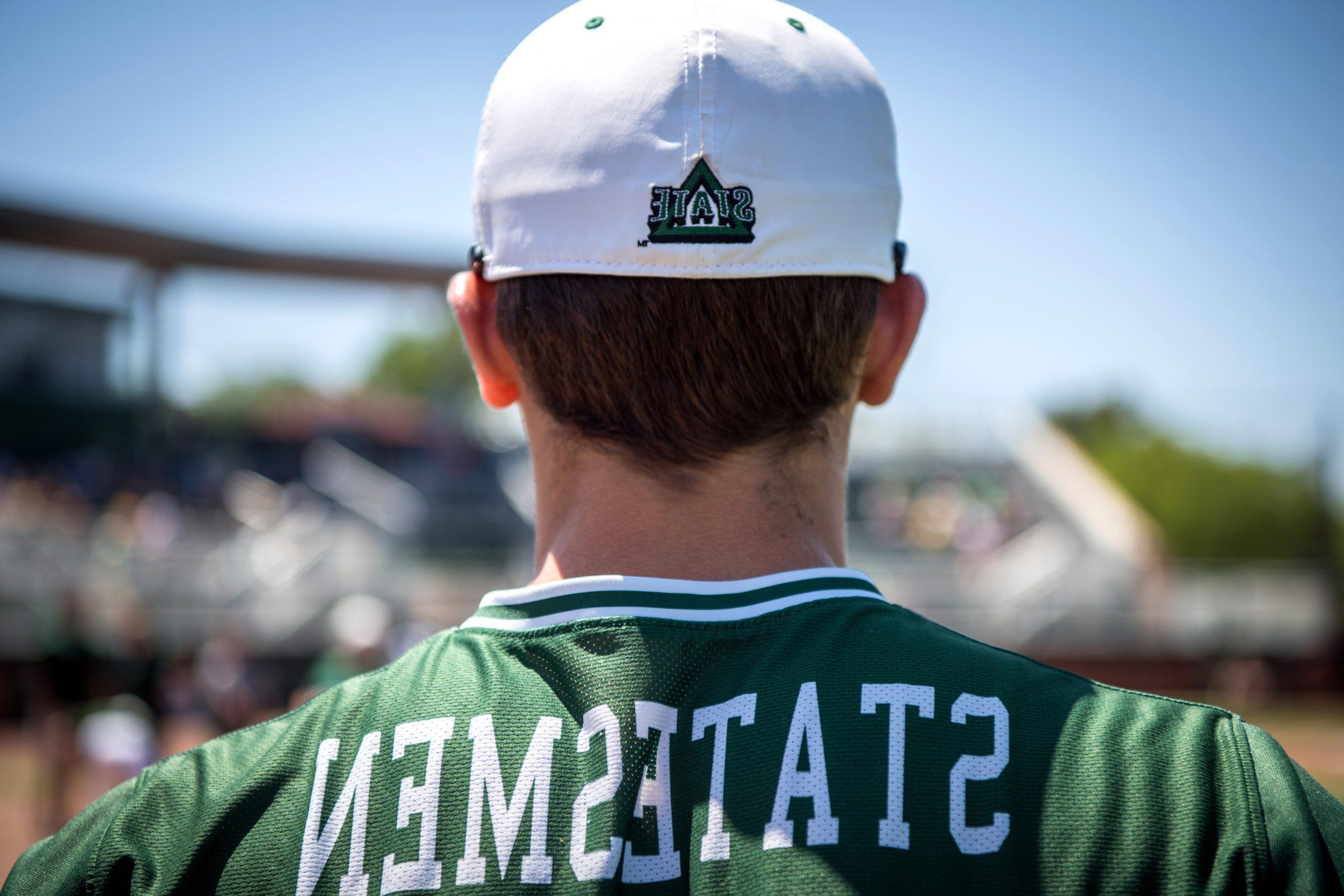 Delta State Baseball player with Statesmen Jersey and Delta State Athletics hat.